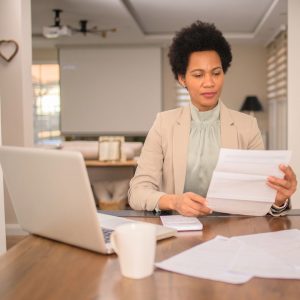 a woman looking at a letter